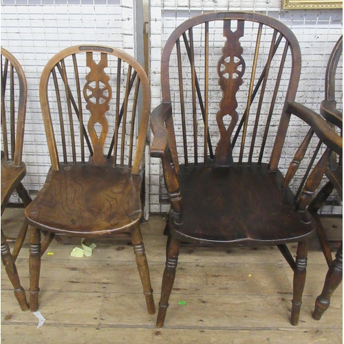 2 - A pair of Windsor open armchairs, with elm seats and pierced wheel back splat, together with four si... 