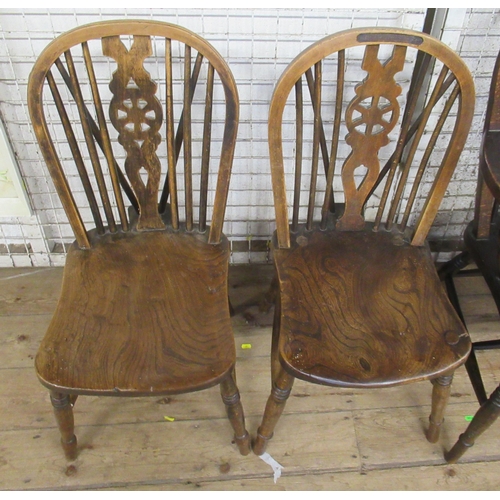 2 - A pair of Windsor open armchairs, with elm seats and pierced wheel back splat, together with four si... 