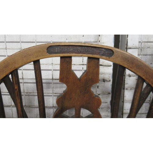 2 - A pair of Windsor open armchairs, with elm seats and pierced wheel back splat, together with four si... 