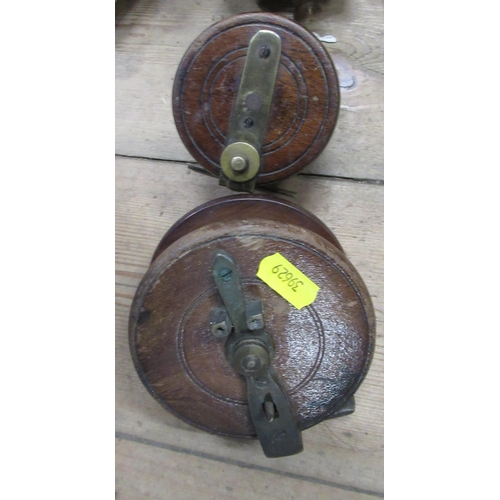 217 - The Allcock Aerial fishing reel, together with a Penn No.85 fishing reel and two wooden fishing reel... 