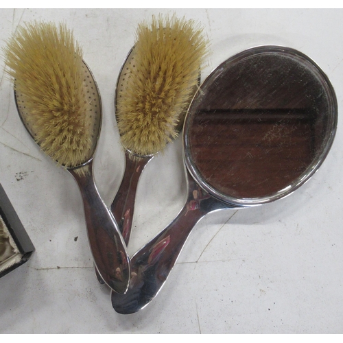 240 - Two silver and tortoiseshell dressing table brushes, together with a silver and tortoiseshell dressi... 