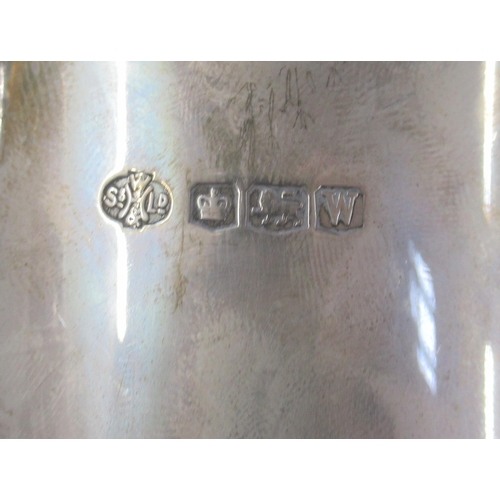 257 - A hallmarked silver tankard, engraved with date and initials, height 4.5ins, weight 11.5oz