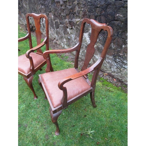 26 - A pair of oak open armchairs