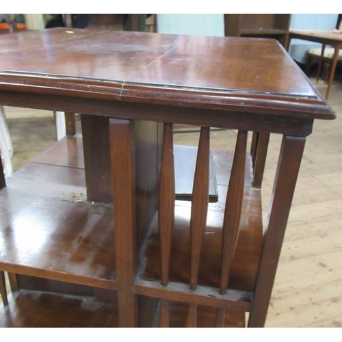 27 - A mahogany revolving book stand, on casters, 24ins x 24ins, height 40ins