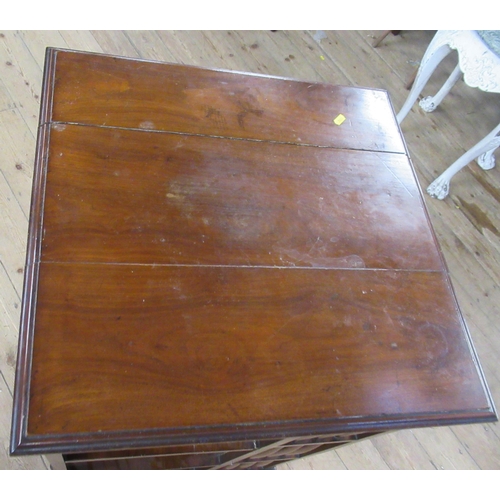 27 - A mahogany revolving book stand, on casters, 24ins x 24ins, height 40ins