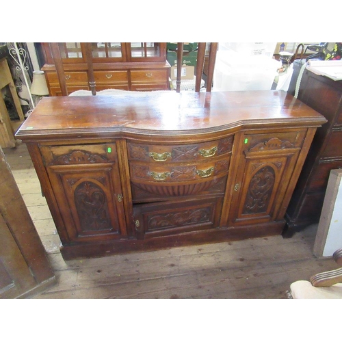 33 - An Edwardian walnut side board together with a mahogany cabinet