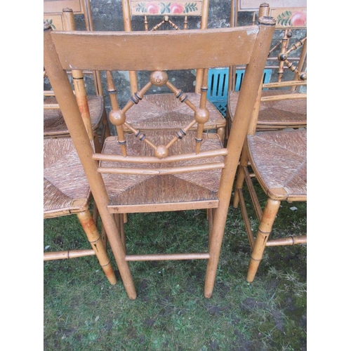 45 - A set of six rush seated chairs 3 of which have floral painted decoration