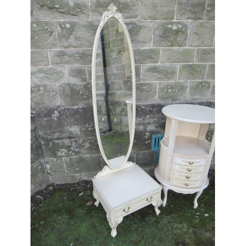 48 - A floor standing cheval mirror together with an oval painted bedside cabinet