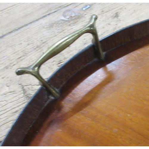 65 - A 19th century mahogany kidney shaped gallery tray, with patera and brass handles, width 22ins