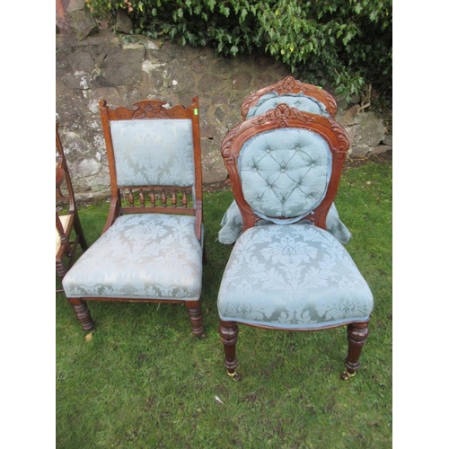 77 - An Edwardian saloon settee with inlaid decoration together with a pair of 19th century dining chairs... 