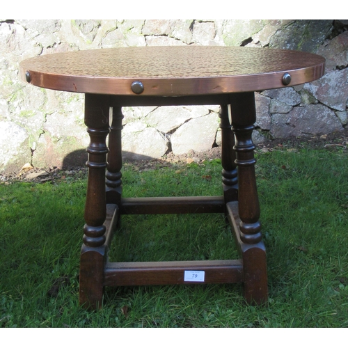 79 - A copper top coffee table width 24ins, height 19ins