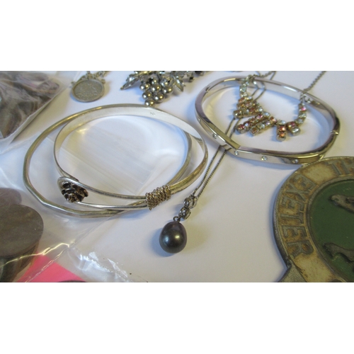 297A - A collection of jewellery, to include three rings and bangles, together with coins etc