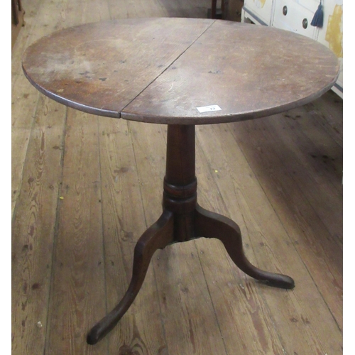 12 - An Antique oak tilt top table, with circular top, diameter 27.5ins, height 26ins