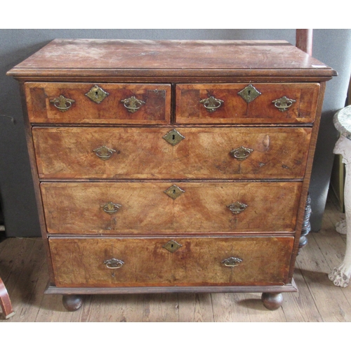 19 - An Antique oak and walnut chest, of two short over three long graduated drawers, on bun feet, 38ins ... 