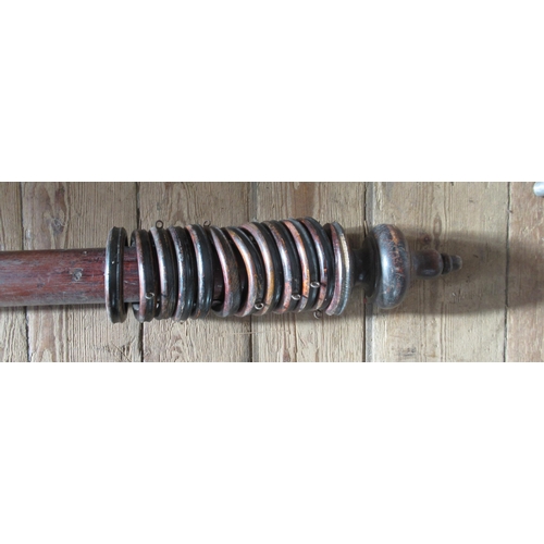 20 - A mahogany curtain pole, length 77ins