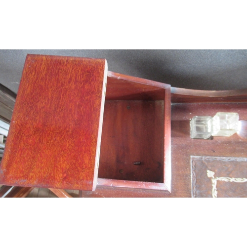 25 - An Edwardian mahogany desk, with inset leather writing surface, with various compartments, fitted wi... 