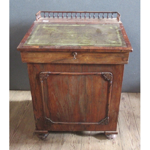 26 - A 19th century rosewood davenport, with inset leather sloping writing surface, the interior fitted w... 