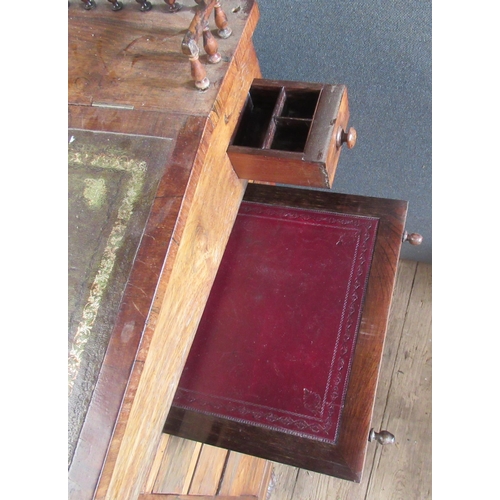 26 - A 19th century rosewood davenport, with inset leather sloping writing surface, the interior fitted w... 