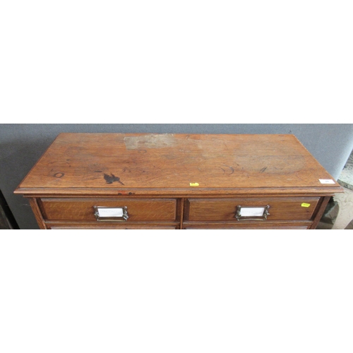 28 - An oak set of drawers, consisting of two banks of eight drawers, 36ins x 14.5ins, height 42ins