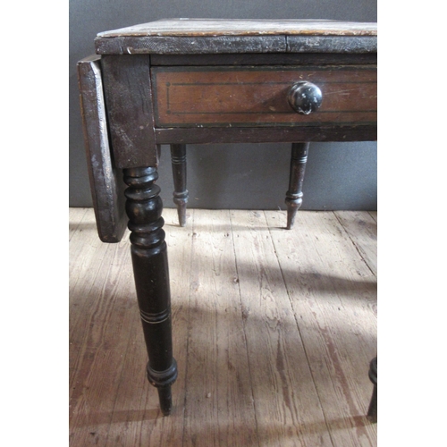 33 - An oak drop leaf table, the top with parquetry decoration, fitted with end drawer, raised on turned ... 