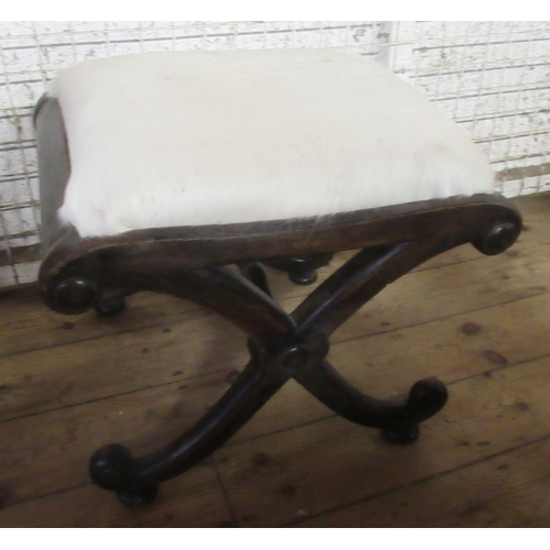 34 - An oak cross framed stool, with pony hair covered seat, height 18ins, 20ins x 16ins