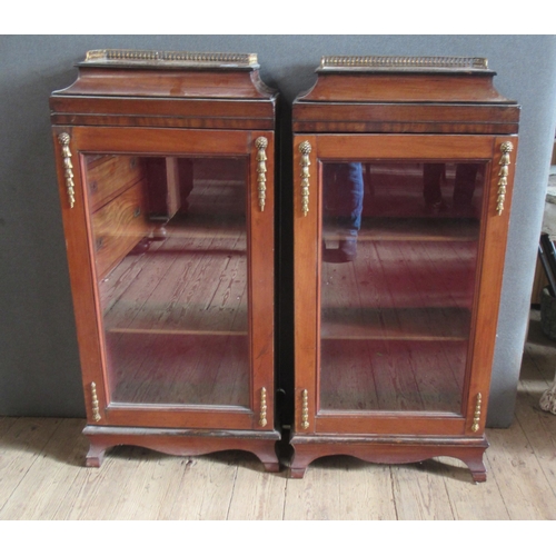 37 - A pair of 19th century mahogany glazed cabinets, with gilt metal galleries and mounts, 19.5ins x 9in... 