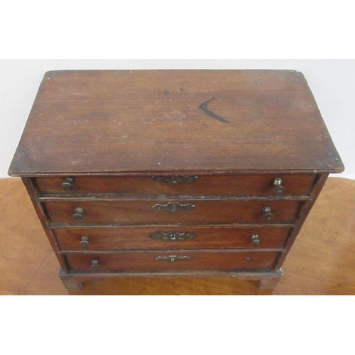 4 - A miniature chest, of four long drawers, 9ins x 4.75ins, height 8ins