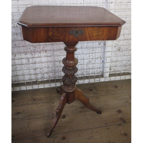 40 - A mahogany work table, the hinged top revealing compartments, on turned column, 19.5ins x 15ins, hei... 