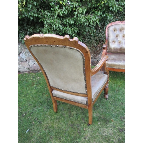 41 - A pair of 19th century mahogany open arm chairs with leather seat and back raised on reeded turned l... 