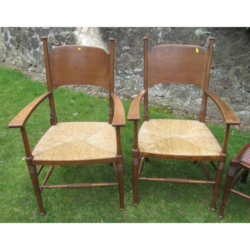 44 - A set of 6 (4+2) William Birch Arts & Crafts oak dining chairs, the armchairs with wicker seats, the... 