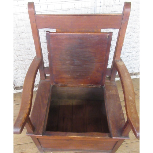 48 - A pine box seat open armchair, with panel back