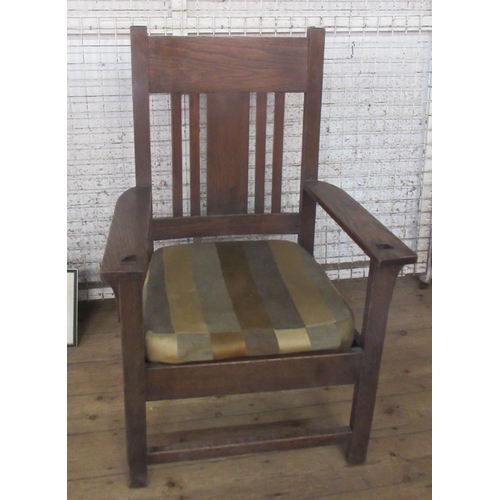 50 - An oak Arts and Crafts style open armchair