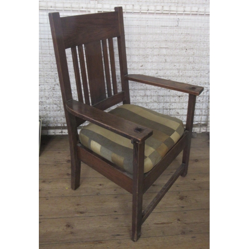 50 - An oak Arts and Crafts style open armchair