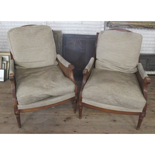 53 - Wesley-Barrel, a pair of bergere and upholstered armchairs