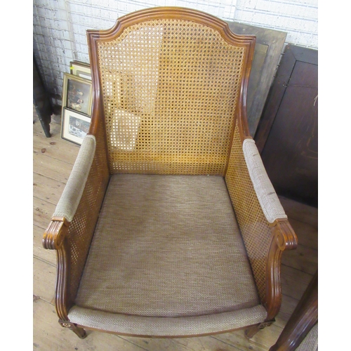 53 - Wesley-Barrel, a pair of bergere and upholstered armchairs