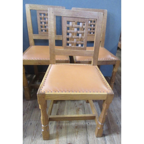 55 - A Robert Thompson Mouseman 1970's set of six oak single dining chairs, with lattice panel to the bac... 