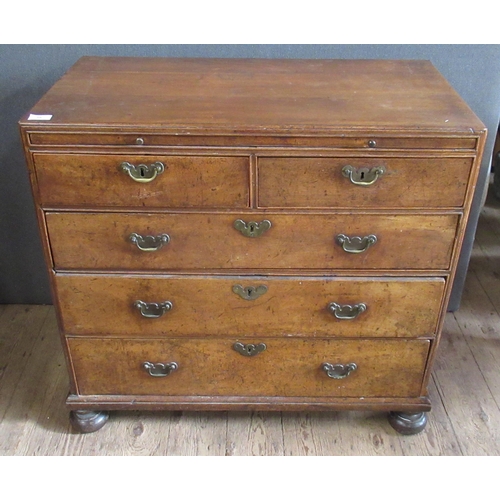 56 - An Antique walnut chest, fitted with a brushing slide over two short and three long graduated drawer... 