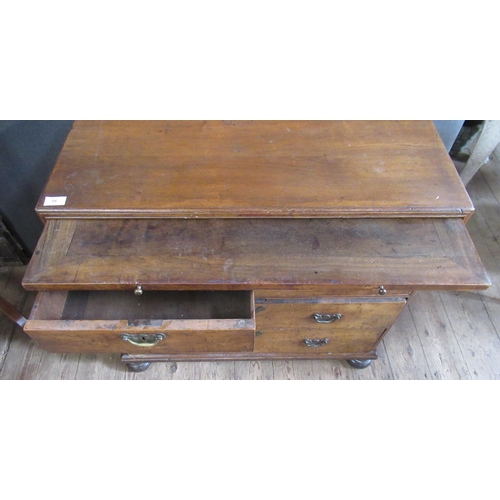 56 - An Antique walnut chest, fitted with a brushing slide over two short and three long graduated drawer... 