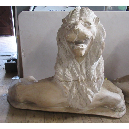 57 - A pair of carved wooden recumbent lions, height 32ins, width 40ins