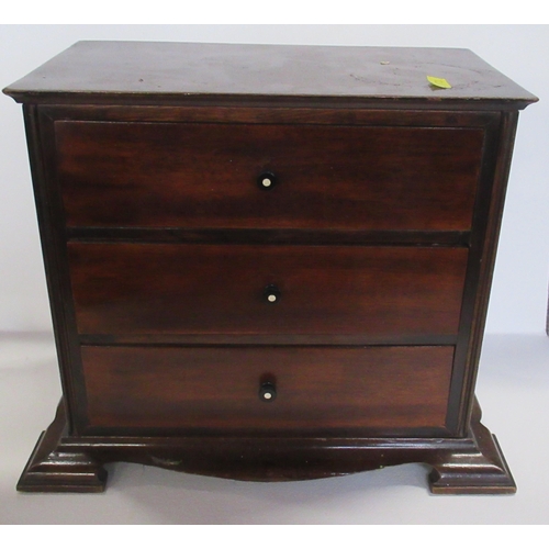 59 - A mahogany table top chest of three drawers, 14ins x 9ins, height 11.5ins