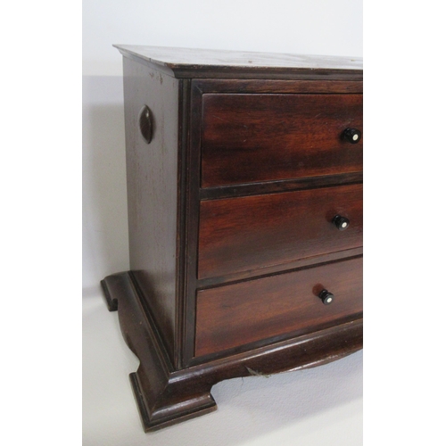 59 - A mahogany table top chest of three drawers, 14ins x 9ins, height 11.5ins