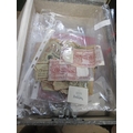 A box of bank notes and coinage including international examples
