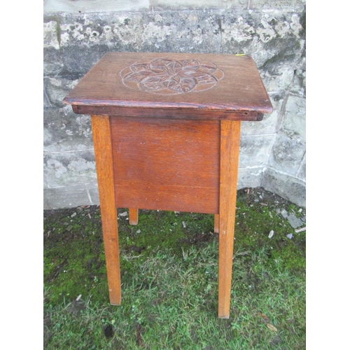 39 - An oak jardiniere stand, with carved decoration to the top, 16ins x 13ins , height 32ins