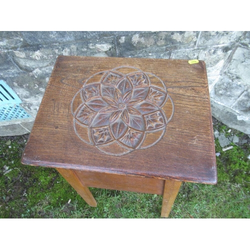 39 - An oak jardiniere stand, with carved decoration to the top, 16ins x 13ins , height 32ins