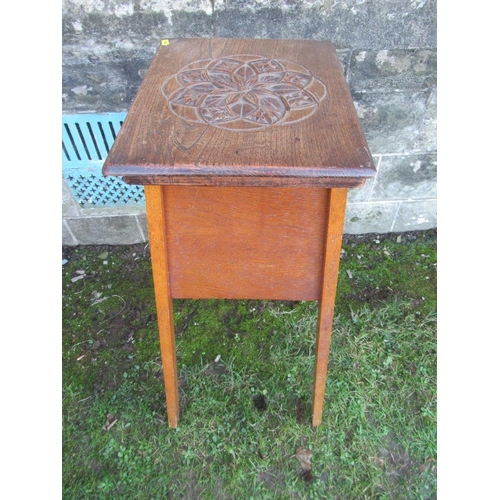 39 - An oak jardiniere stand, with carved decoration to the top, 16ins x 13ins , height 32ins