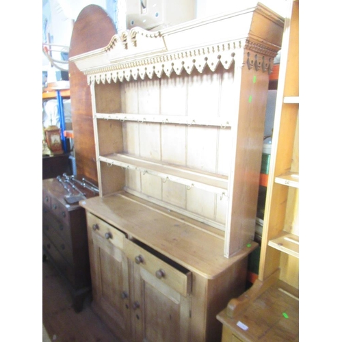 9 - A pine dresser with plate rack over base, filled two drawers over cupboard doors, width 48ins , heig... 