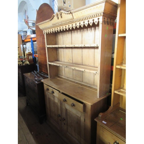 9 - A pine dresser with plate rack over base, filled two drawers over cupboard doors, width 48ins , heig... 
