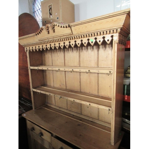 9 - A pine dresser with plate rack over base, filled two drawers over cupboard doors, width 48ins , heig... 