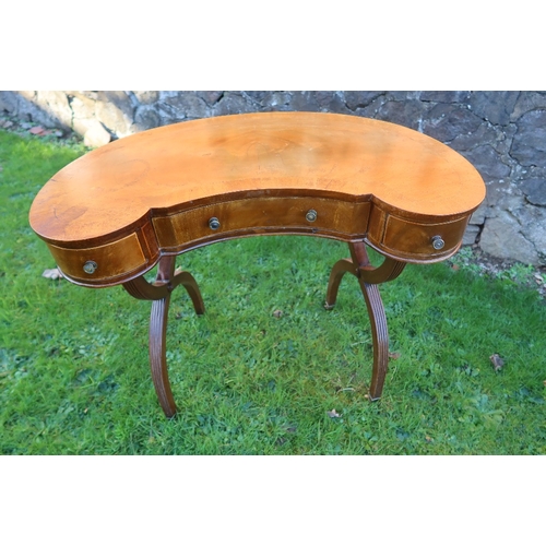 17A - A kidney shaped writing table