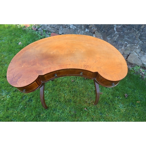 17A - A kidney shaped writing table